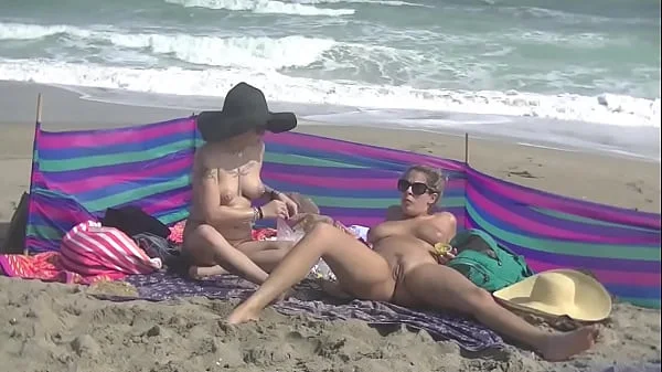 Exhibitionist Wife 484 Part 5 - Mrs Ginary and Mrs Nikki Brooks Teasing Nude Beach Voyeur!  Spreading legs and teasing cocks in public!