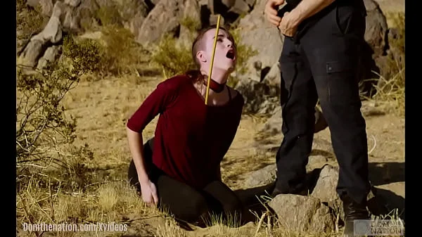 Petite, hardcore submissive masochist Brooke Johnson drinks piss, gets a hard caning, and get a severe facesitting rimjob session on the desert rocks of Joshua Tree in this Domthenation documentary