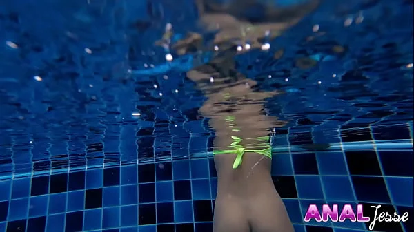 Asian Girl Swims with Big Butt Plug