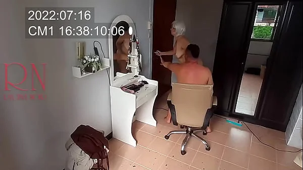 Nudist barbershop. Nude lady hairdresser in an apron makes client to strip. Security camera. The client is surprised. real spy cam 1